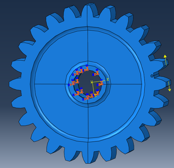 the gear is fully constrained in the centre, while a force is applied to separate both teeth and open the crack